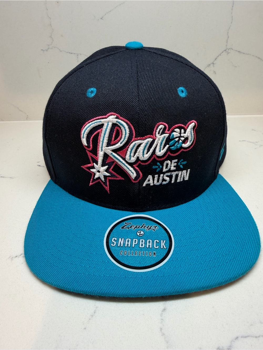 Raros de Austin Black & Teal Snapback Hat with Pink Accents